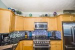 The Pointe, Well-Equipped Kitchen with Stainless Steel Appliances and Granite Counters